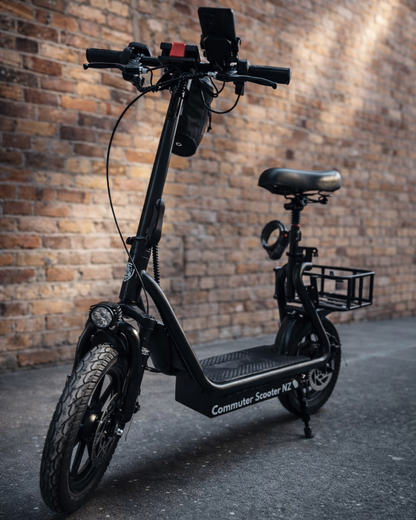 Black electric commuter scooter against a brick wall
